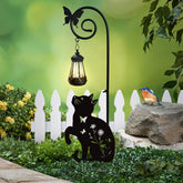 YY Gardenia cat stake with solar light, front view illuminating a garden path.