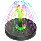 Yzert solar fountain with green flower LED lights enhances daytime garden ambiance.