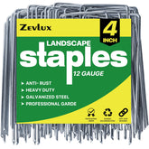 Zevlux 4-inch landscape staples securing landscape fabric for garden beds.