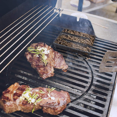 3 BUZZLETT smoker tray in action on a grill.