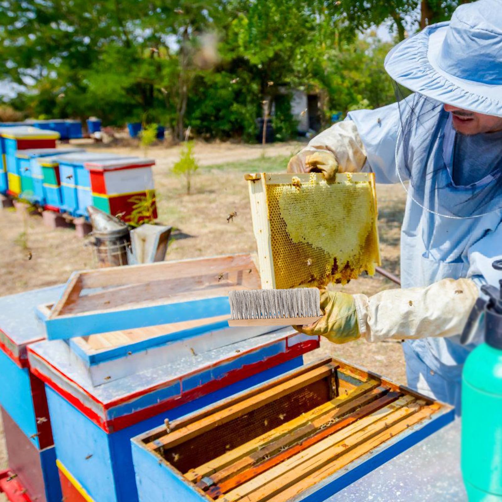 Acostop beekeeping brush easily clears bees from clothing after tasks.