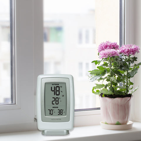 AcuRite 00611 wireless sensor and hygrometer capture humidity levels for home comfort.