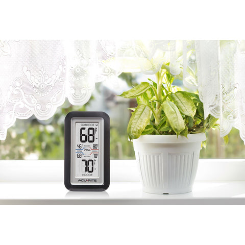AcuRite 02043 digital thermometer on tabletop or wall-mountable for flexible setup.