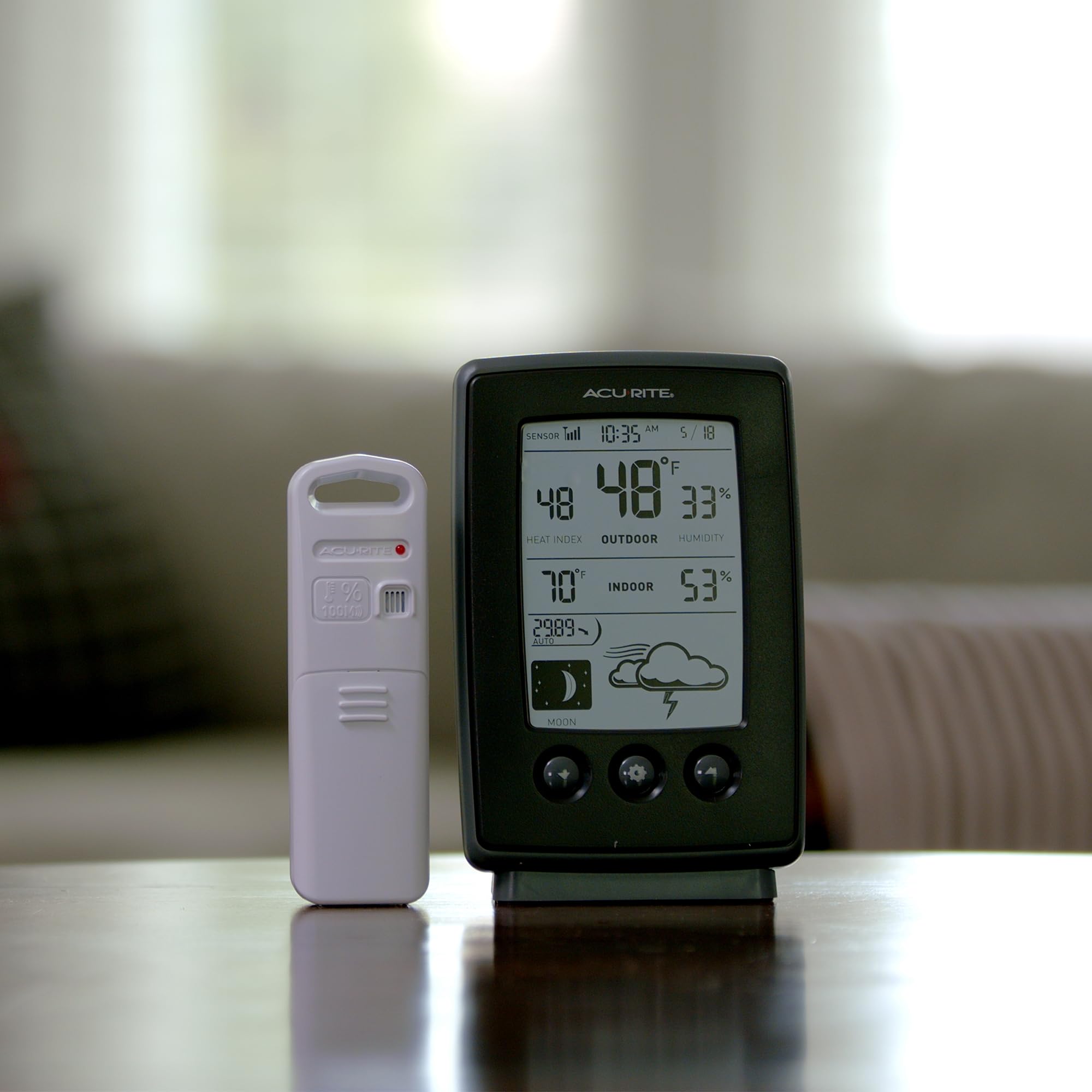 AcuRite Intelli-Time clock shows current time and date with automatic self-setting.