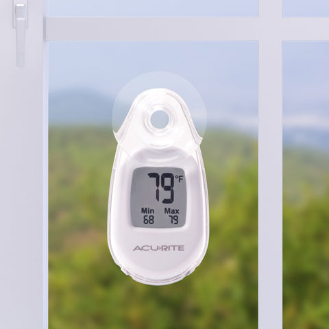 AcuRite thermometer with suction cup mounted for outdoor window use with reversible design