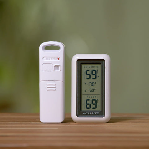 AcuRite thermometer with trend arrows indicating rising or falling temps