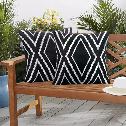 Adabana two-pack outdoor pillow covers shown on patio furniture setup.