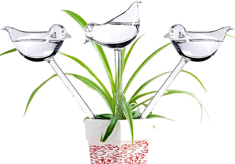 Adabocute bird-shaped watering globe close-up showing decorative plant care function.