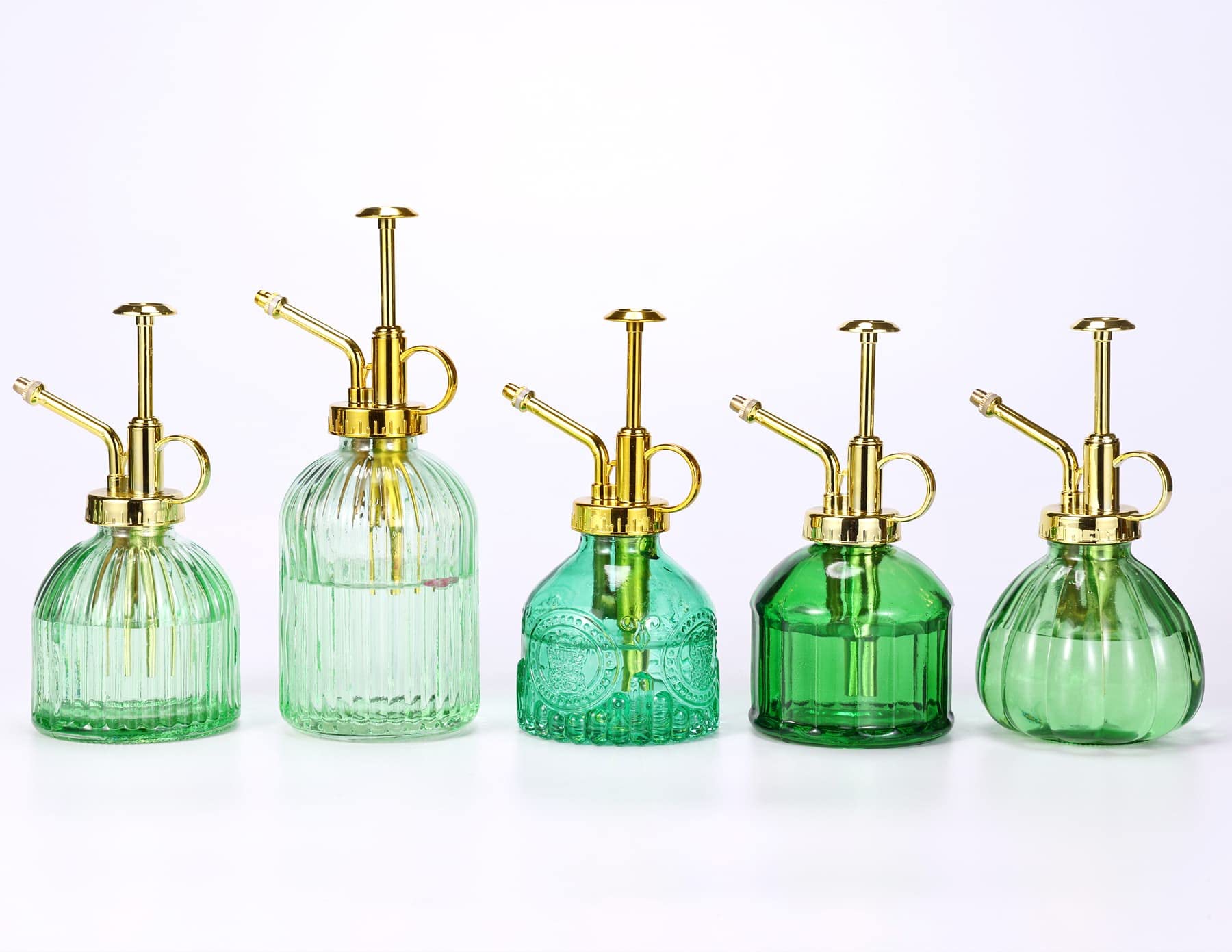 Aebor decorative plant sprayer enhances patio decor while watering herbs.