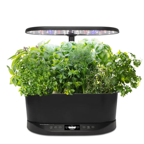 AeroGarden Bounty Basic front view on a kitchen counter showcasing compact indoor design for small spaces