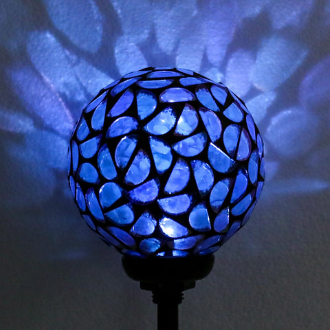 Afirst night time illumination brightens entryways with decorative solar glow.