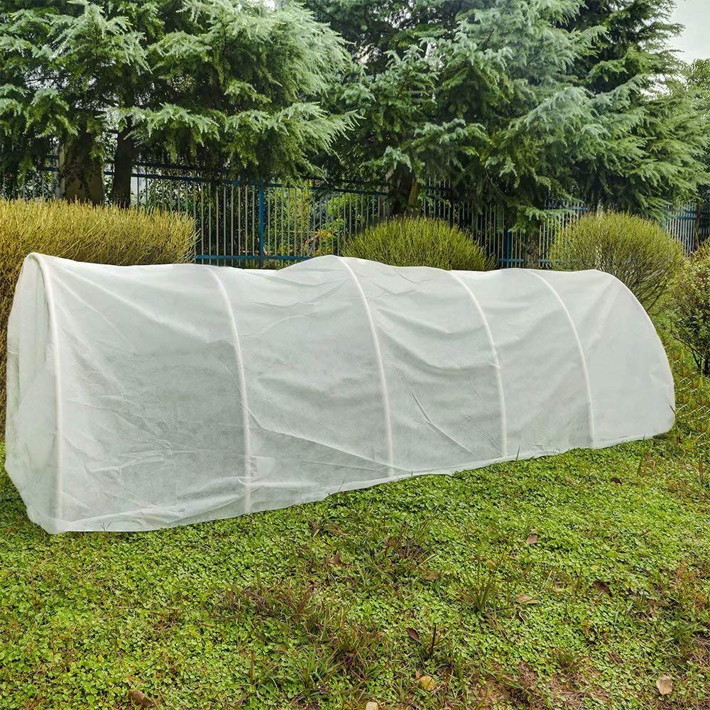 Agfabric fruit tree protected under cover, guarding blossoms from early cold snaps.