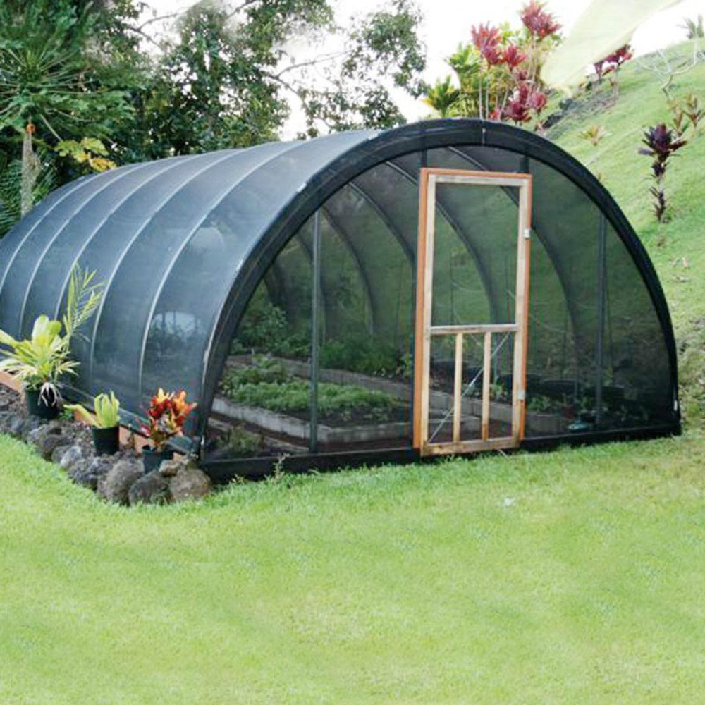 Agfabric shade cloth cooling a greenhouse interior on hot days.