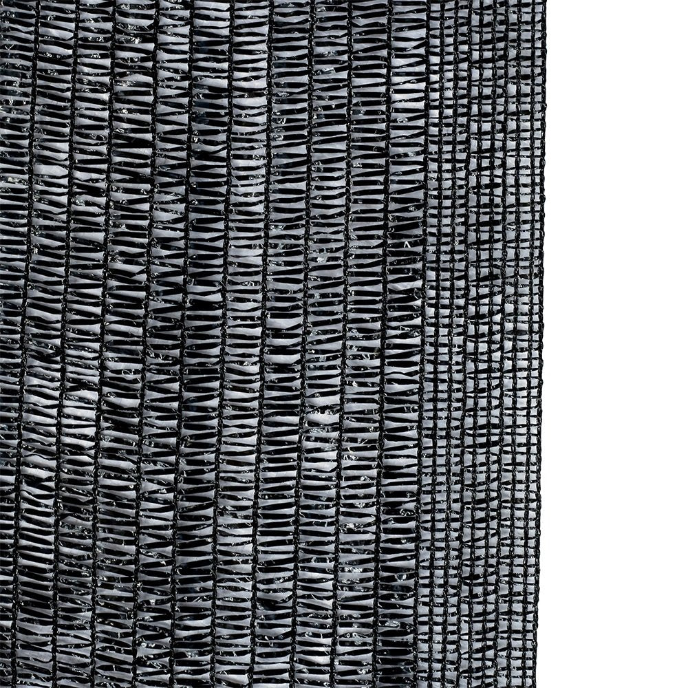 Agfabric Sun-Block shade cloth in garden-greenhouse setting cools plants while letting water through.