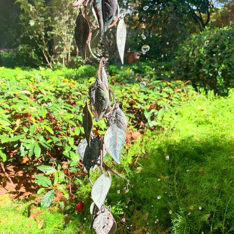 Aifeorzo rain chain creates soft rain ambiance on patio.