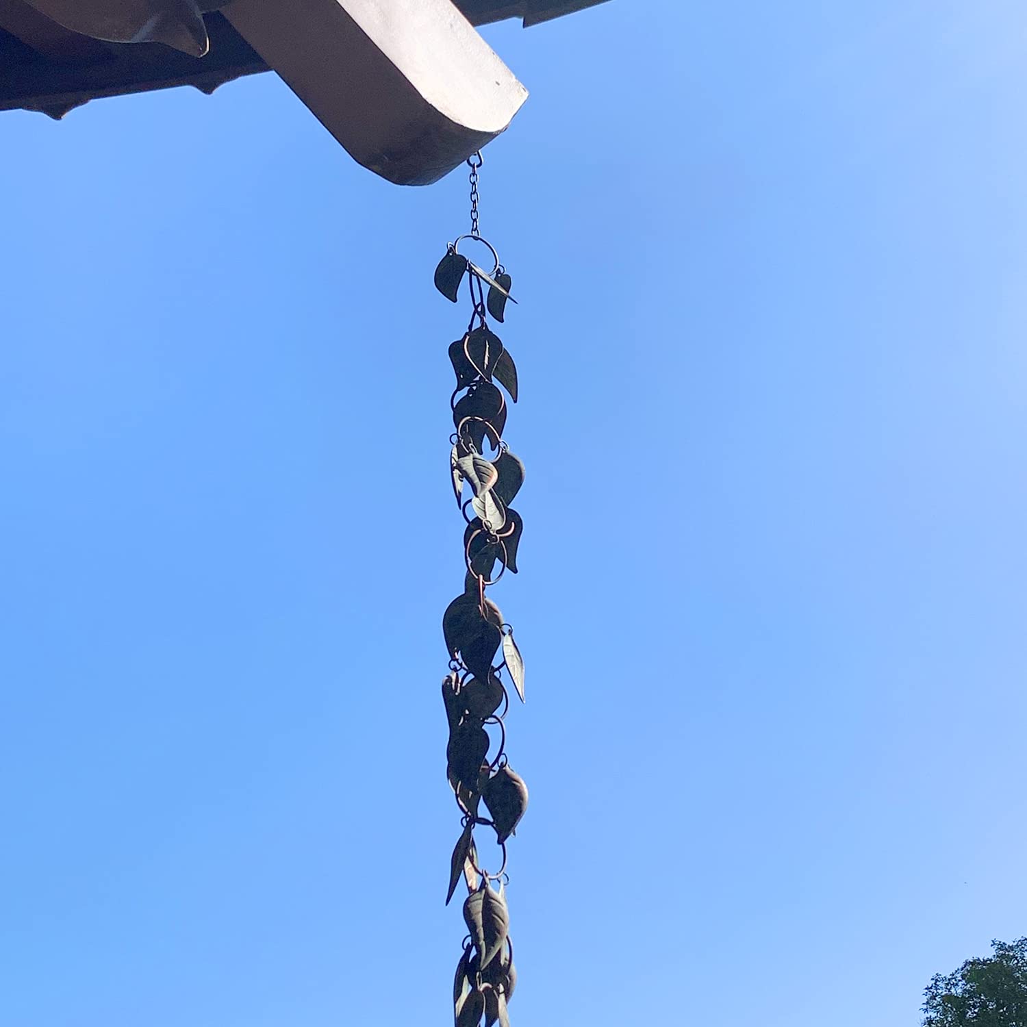Aifeorzo rain chain catches sunlight and becomes garden art.