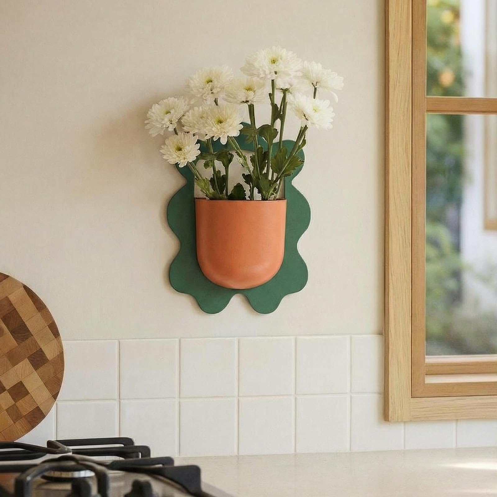 AimtoHome green-frame planter pairs with orange pot for modern-boho contrast.