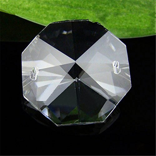 Aiskaer crystal pendant with gold pin shines on a fixture