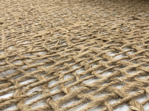 AK TRADING CO. Biodegradable jute mat blending with soil surface.