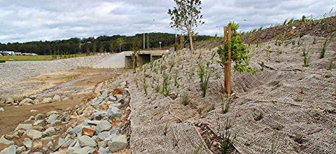 AK TRADING CO. Eco-friendly erosion control fabric ready for installation.
