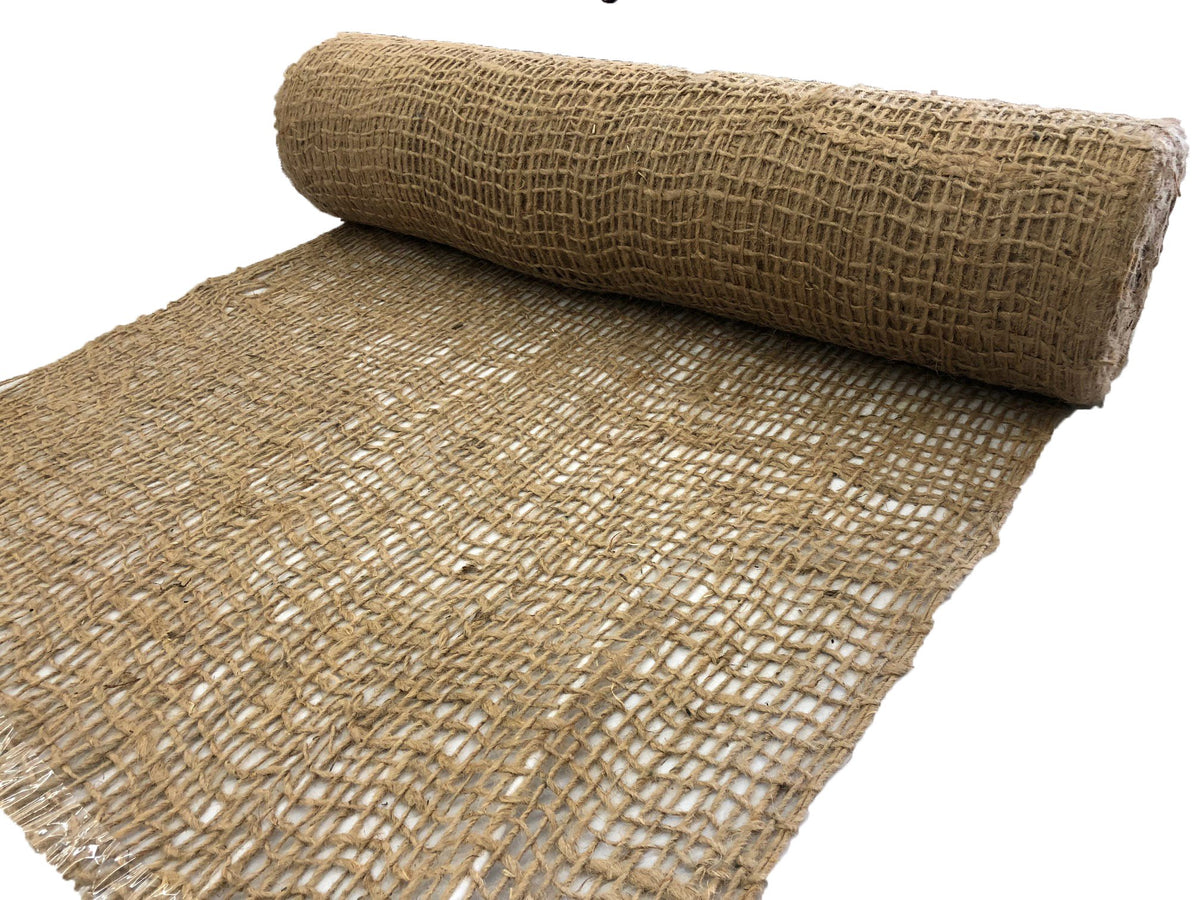 AK TRADING CO. Jute erosion control blanket on slope to prevent erosion.