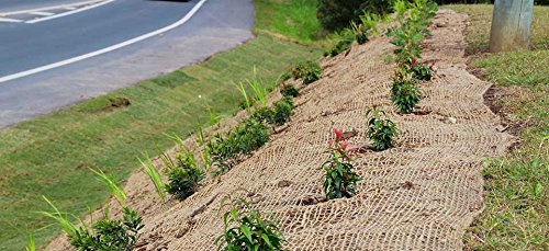 AK TRADING CO. Jute stabilization blanket contouring a hillside.