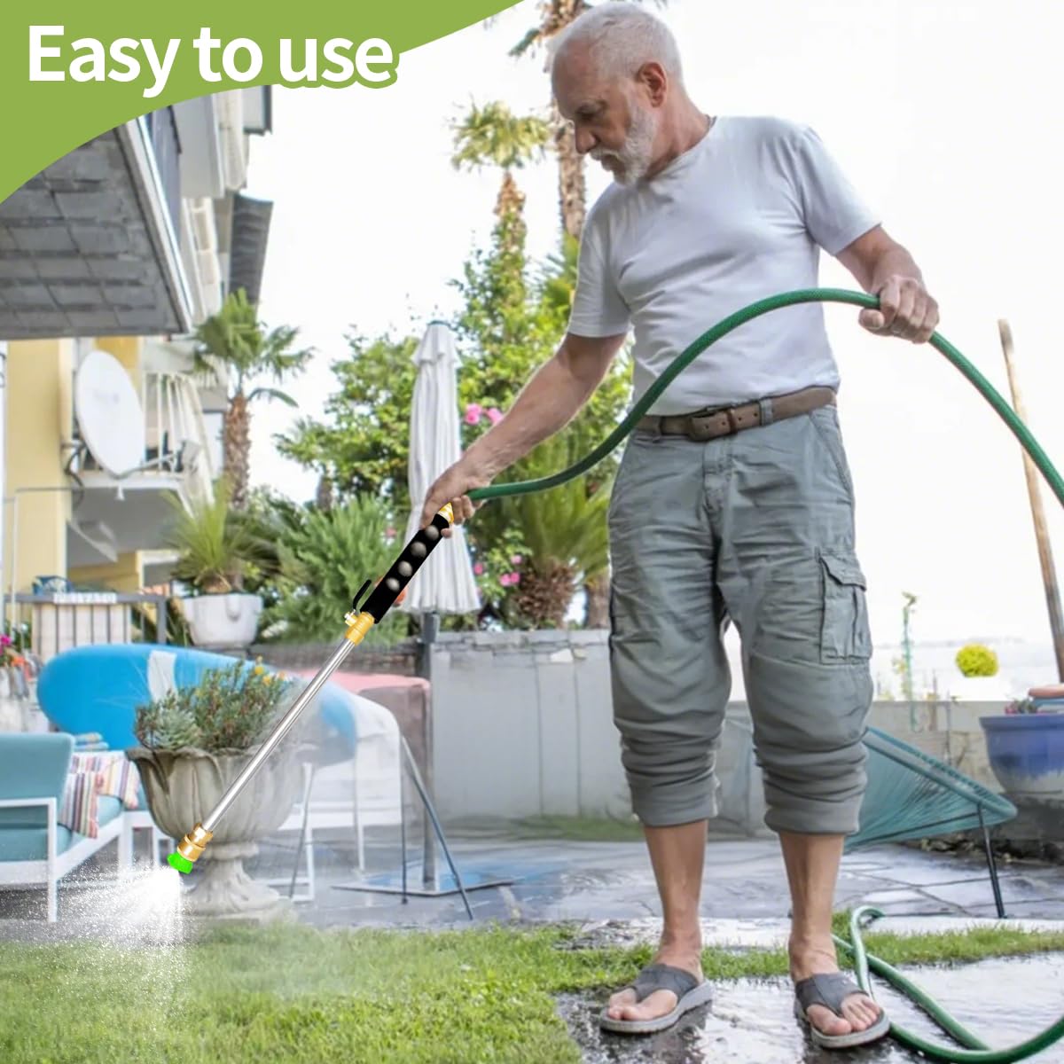 Aklimida jet nozzle in use for garden and driveway cleaning