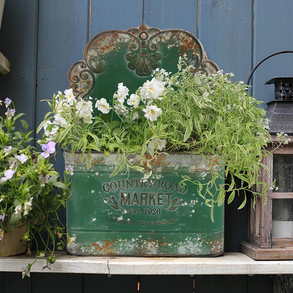 All Chic metal wall planter filled with flowers enhances curb appeal