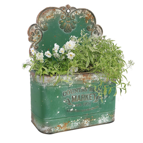 All Chic metal wall planter front view showcases green rustic finish for outdoor decor