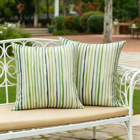 All Smiles machine-washable outdoor pillow cover in sage for easy cleaning