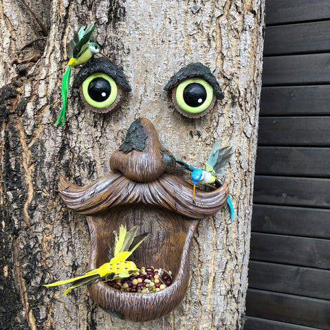 ALLADINBOX Tree Face Birdfeeder glowing eyes add evening garden intrigue.