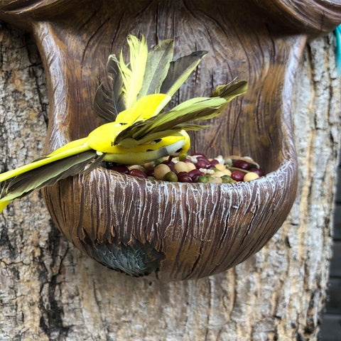 ALLADINBOX Tree Face Birdfeeder resin-bark finish enhances natural outdoor look.