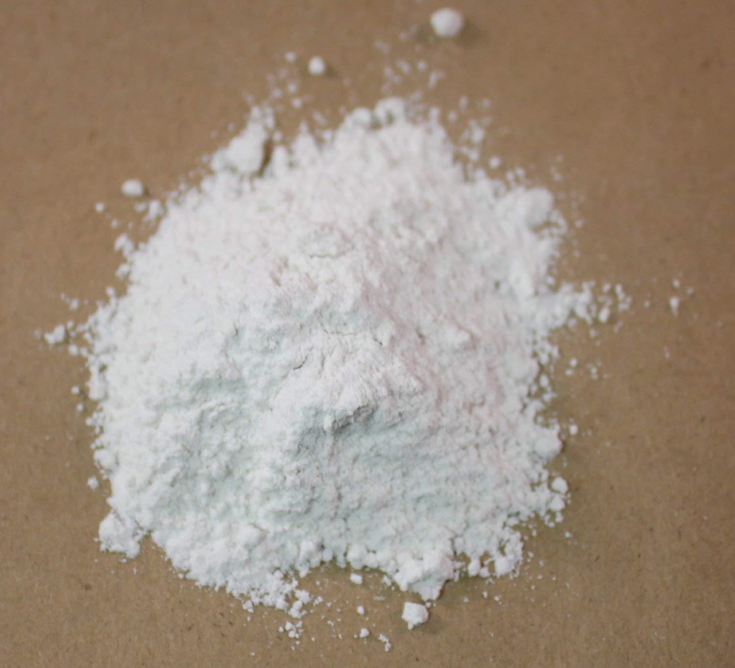 Alpha Chemicals Calcium Sulfate Dihydrate gypsum powder close-up, showing fine texture for soil amendment.