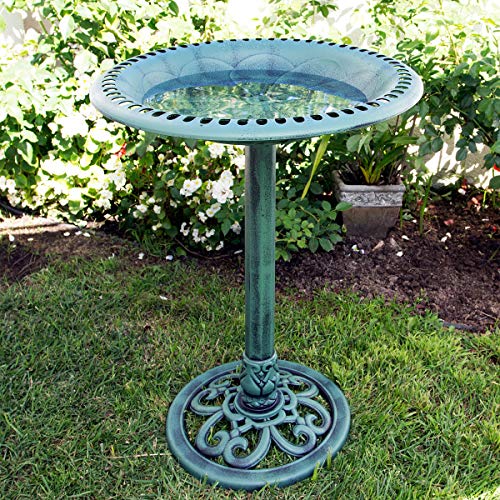Alpine 28-inch birdbath in a lush garden setting.