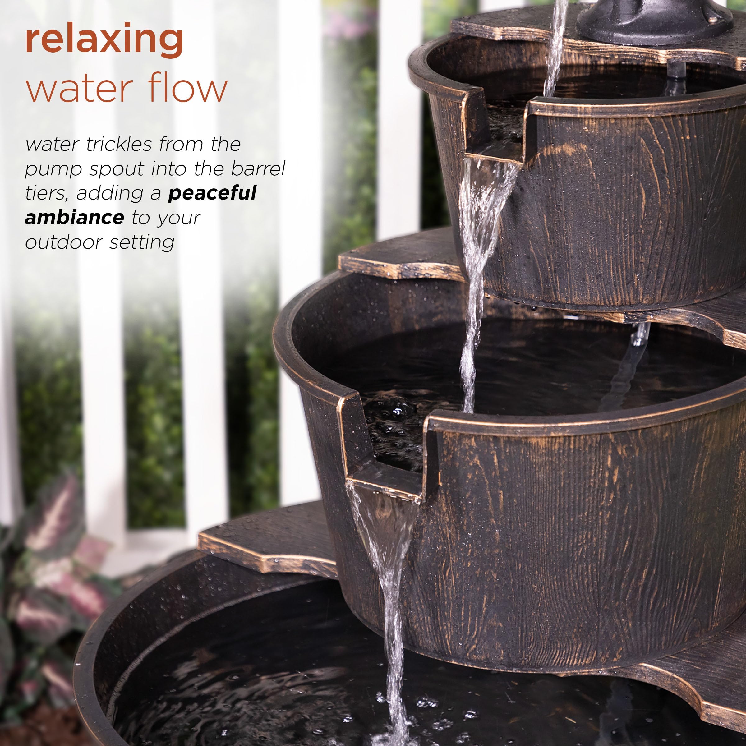 Water trickling from pump spout into barrels for tranquil outdoor sound