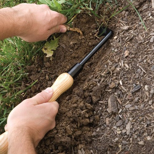 A.M. Leonard Cape Cod Weeder wooden handle offers weather-resistant grip for outdoor gardening.