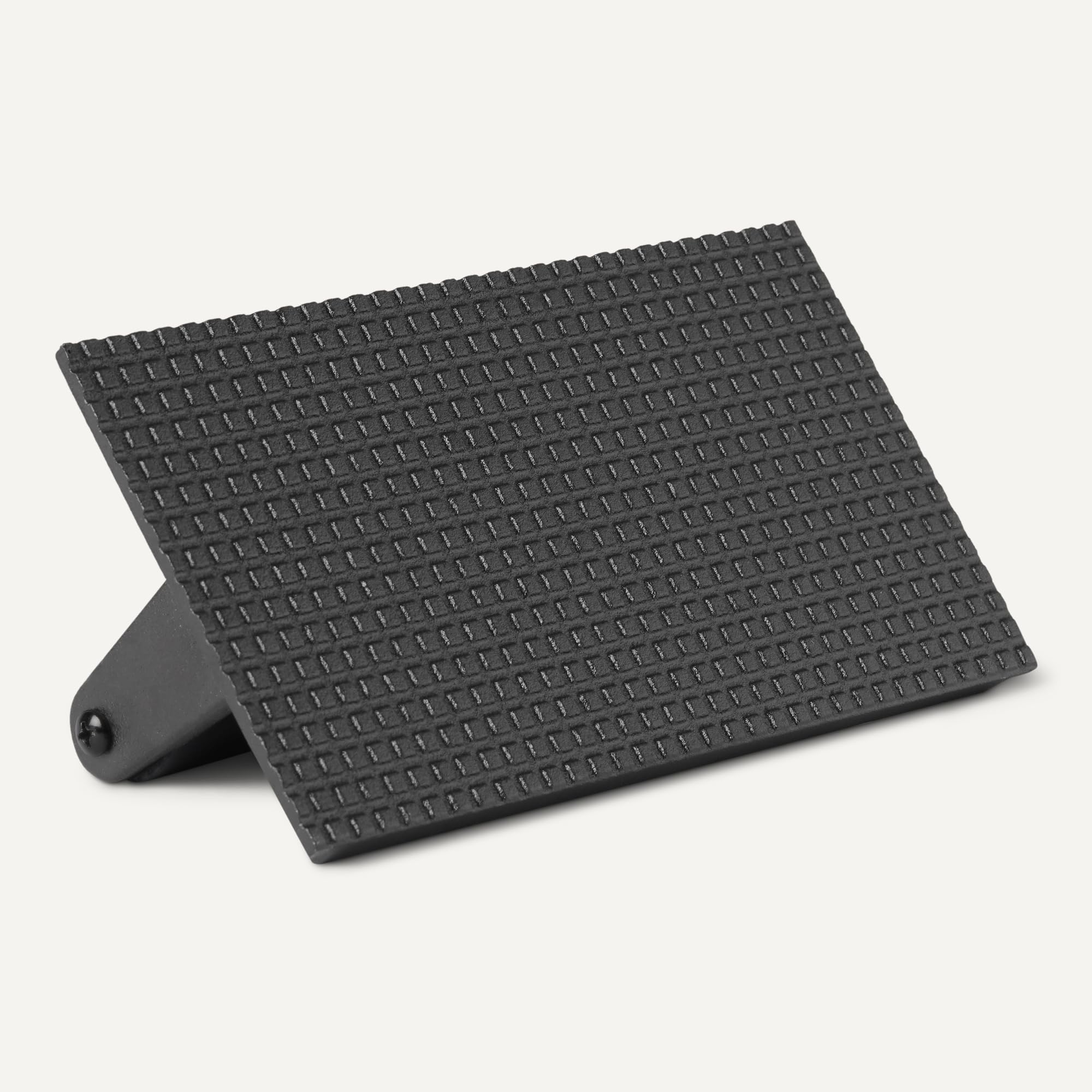 Amazon Basics cast iron surface designed for durability on grills and skillets.