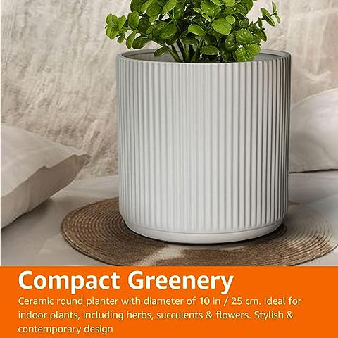 Amazon Basics planter features drainage plugs for adjustable watering control.