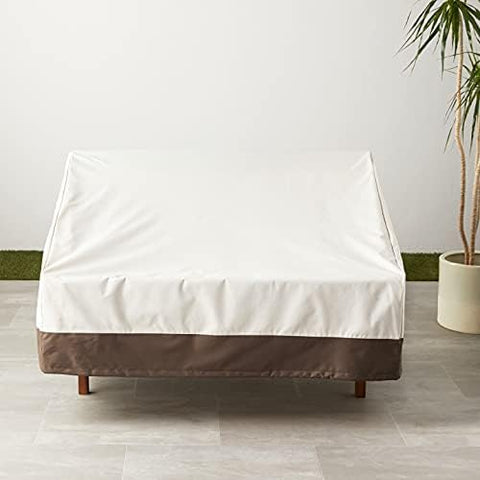 Amazon Basics 2-seater cover includes click-close straps for secure fit on breezy patios.