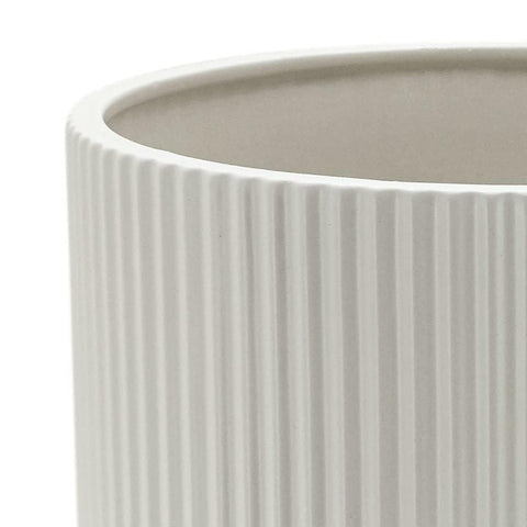 Amazon Basics white fluted ceramic planter suitable for indoor and outdoor settings.