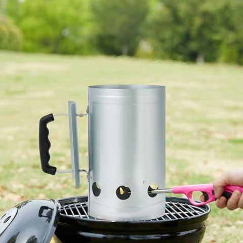 Amazon Basics fire starter chimney in use beside grill pit for ignition.