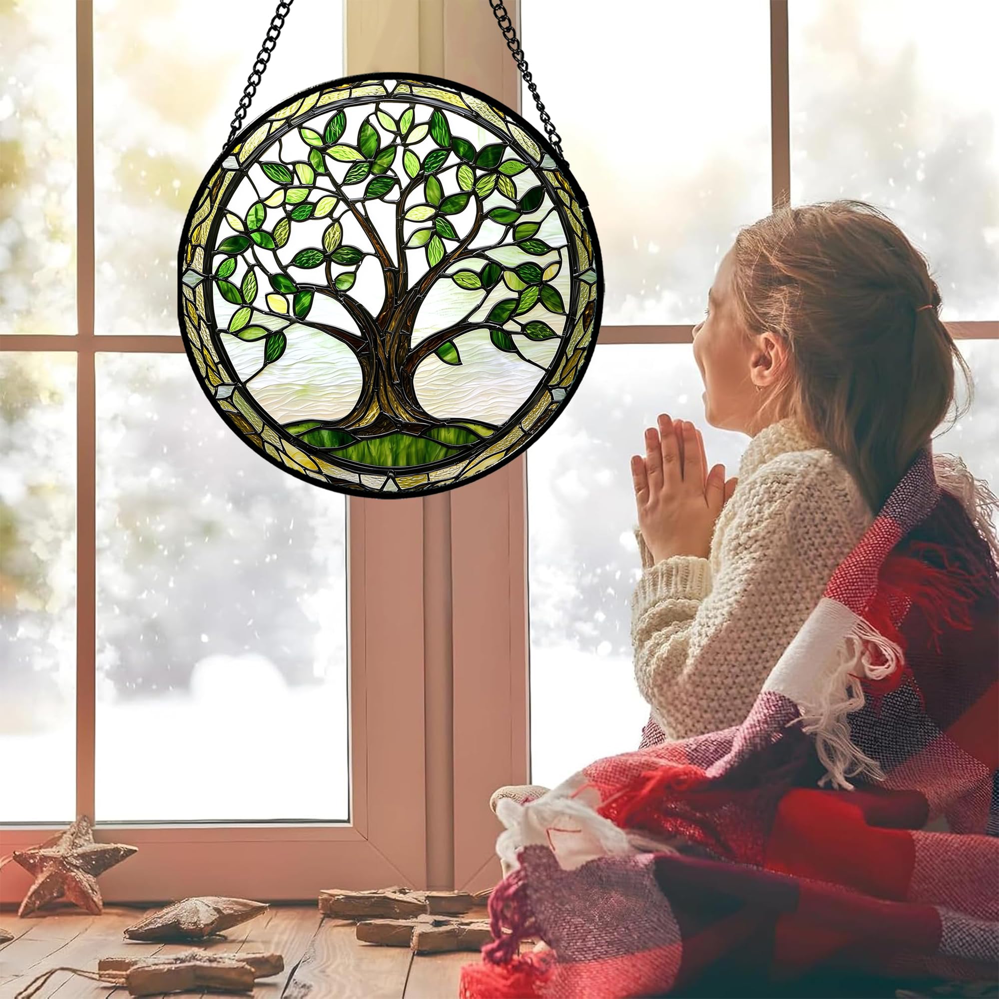 AMDERVEN stained glass window hanging with green leaves adds warm hues to spaces.