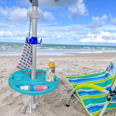 AMMSUN teal umbrella table showing built-in snack trays.