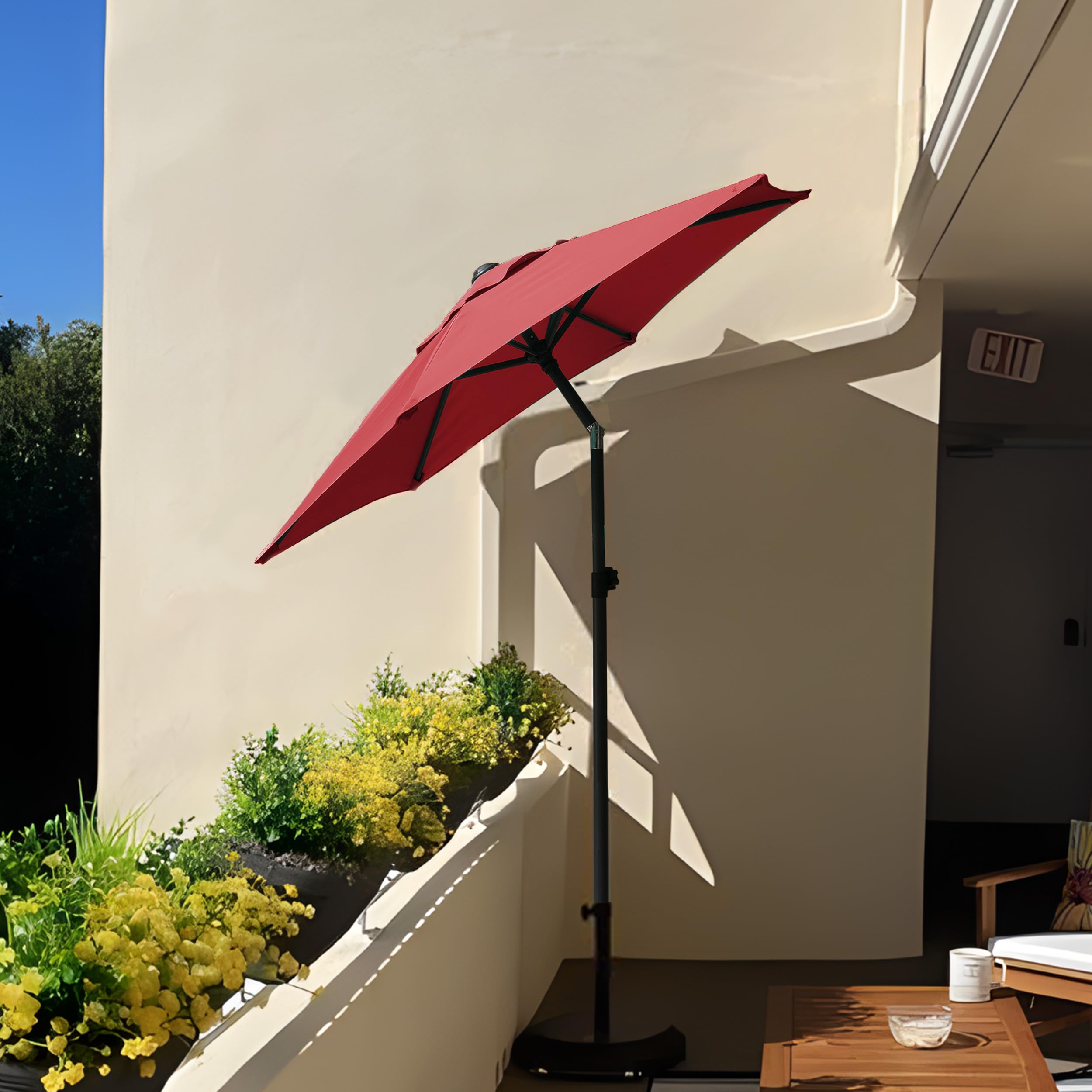 AMMSUN umbrella shown on a deck for outdoor dining and relaxation.