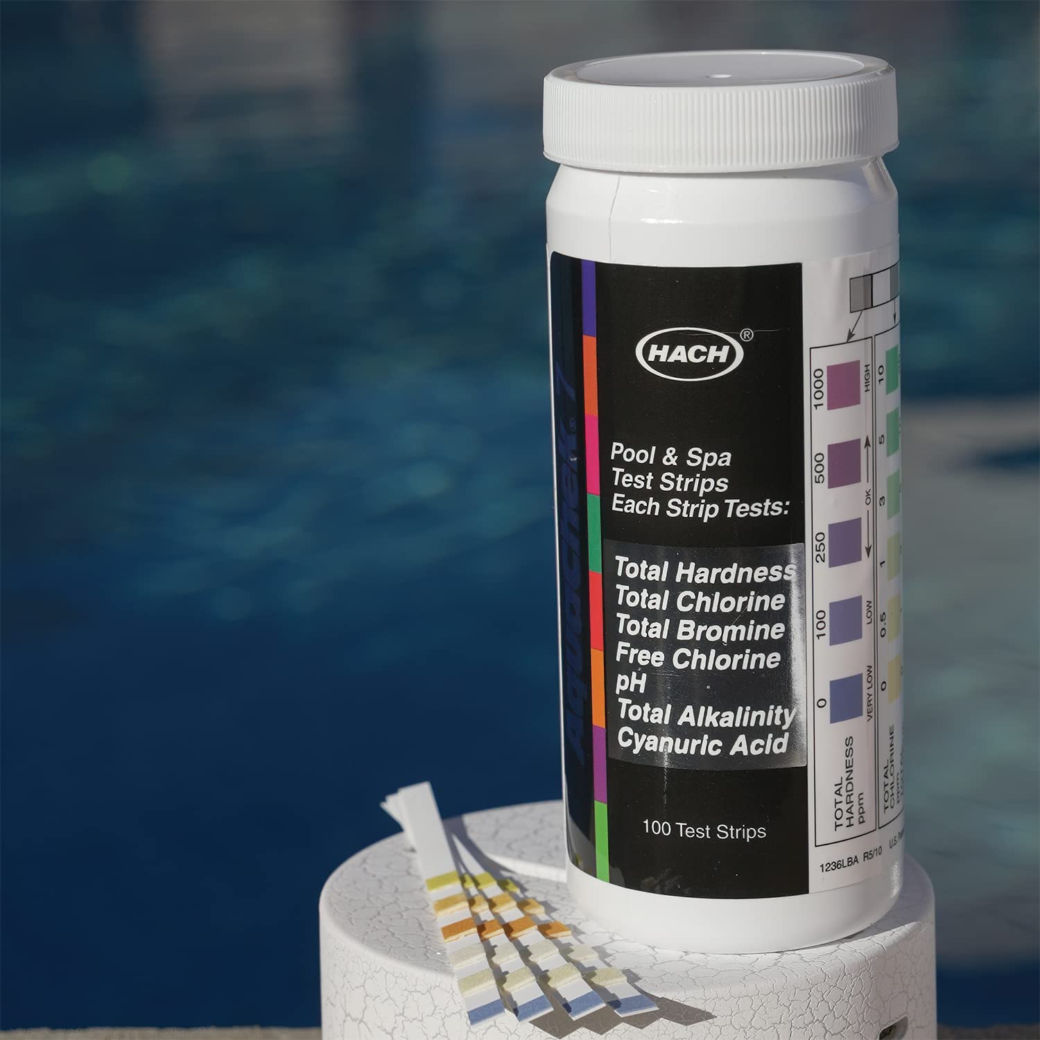 AquaChek strip dipping into water demonstrates fast on-site testing.