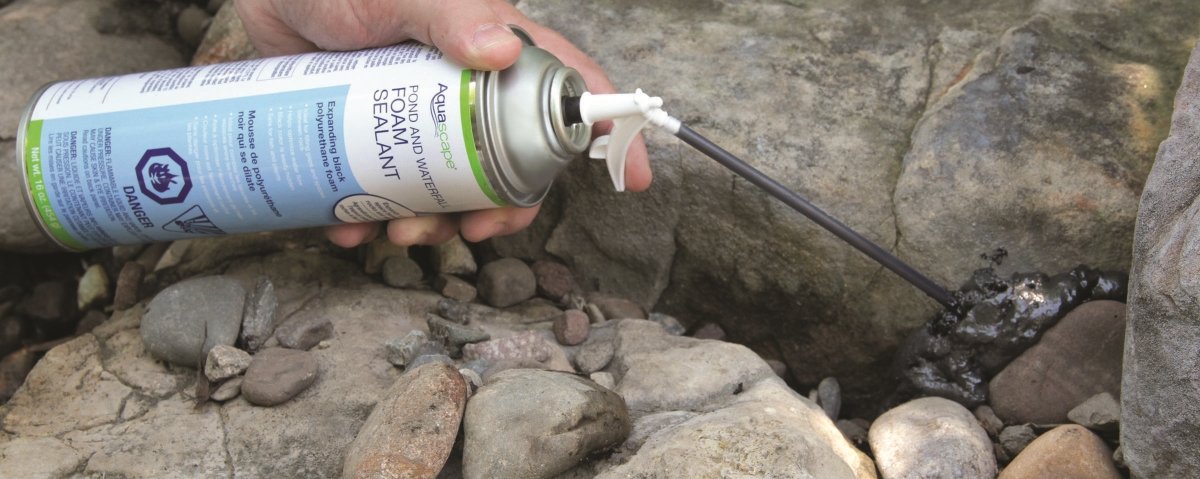 Aquascape foam sealant spray nozzle enables precise, mess-free application in tight rock spaces.