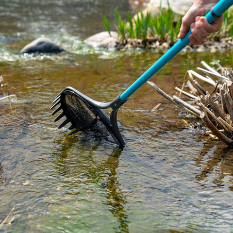 Aquascape Pond Shark Pro rake blades breaking algae for cleanup.