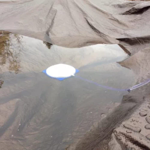 Aquatix Pro winter pool cover in use showing drainage setup.