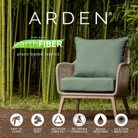 Cushions arranged on outdoor loveseat setup in a garden space.