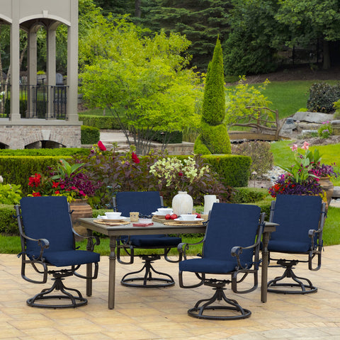 Outdoor garden scene with Arden Selections Leala cushion at dining table